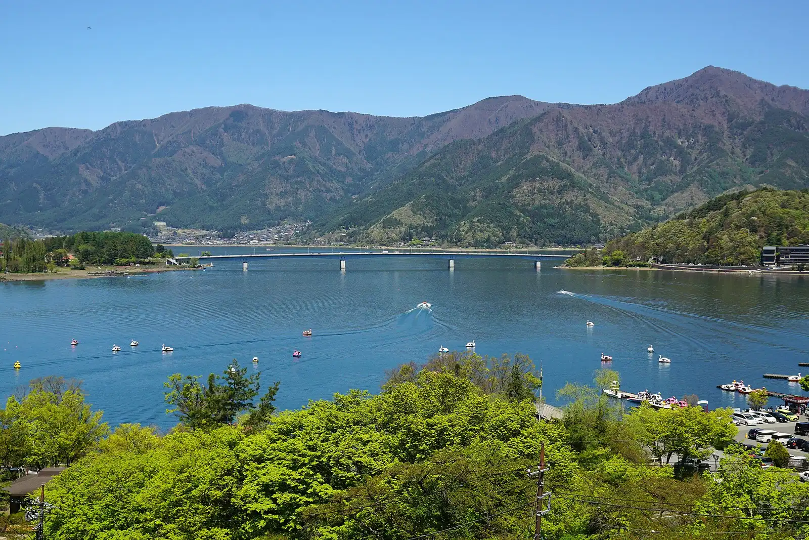 Lake Kawaguchi and Kawaguchiko Ohashi bridge from Mt Tenjo, swan boats below
