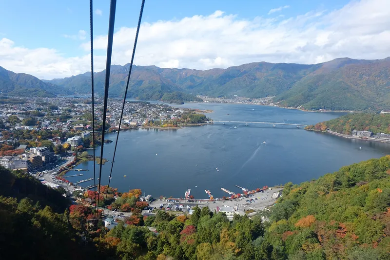 View down the Kachi Kachi Ropeway cables over Lake Kawaguchi in autumn
