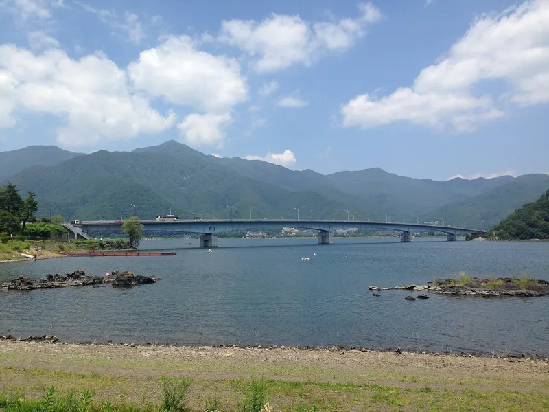Kawaguchiko Ohashi bridge over Lake Kawaguchi from the lava-rock shore